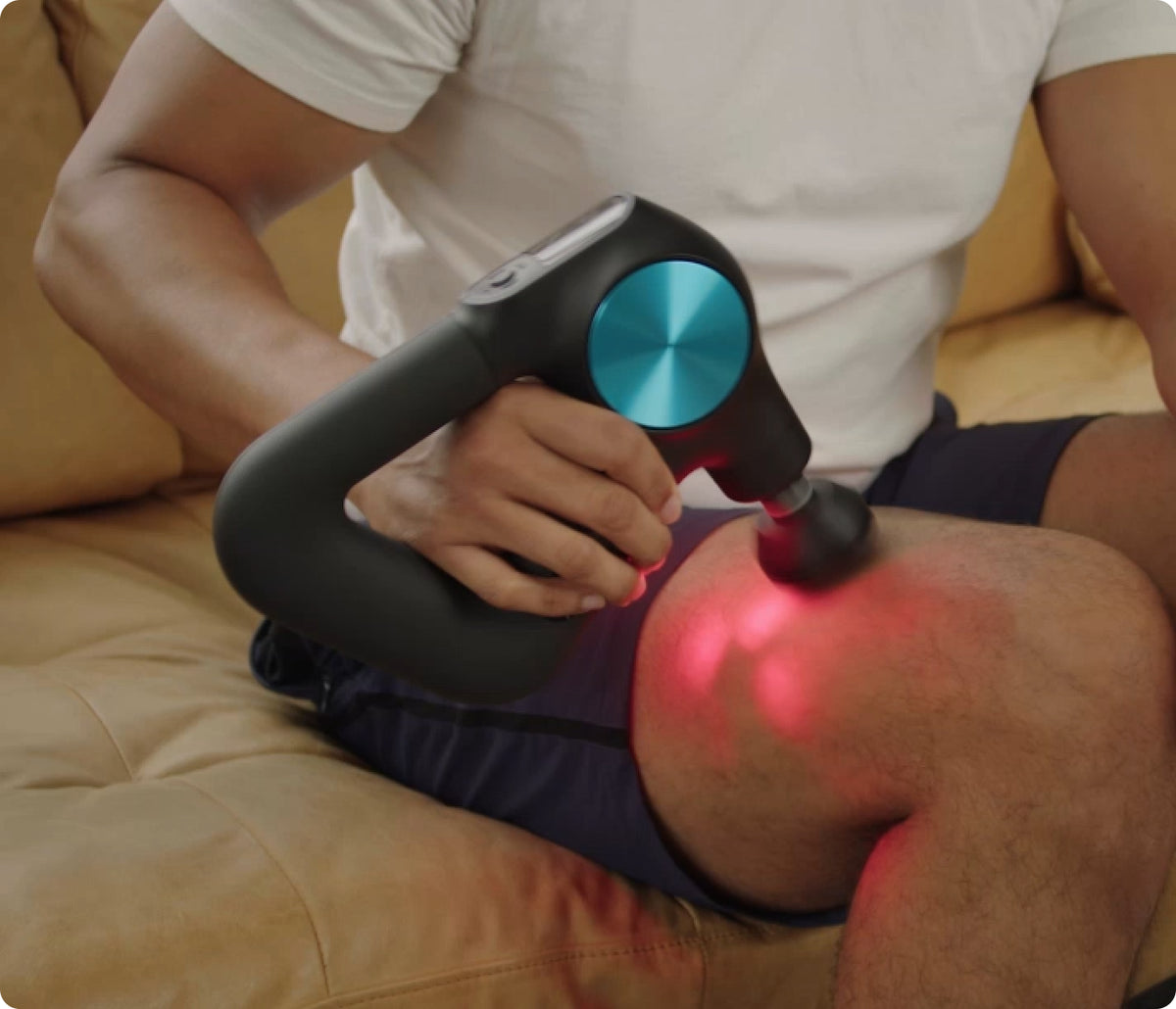 Theragun PRO Plus heated massage on the thigh